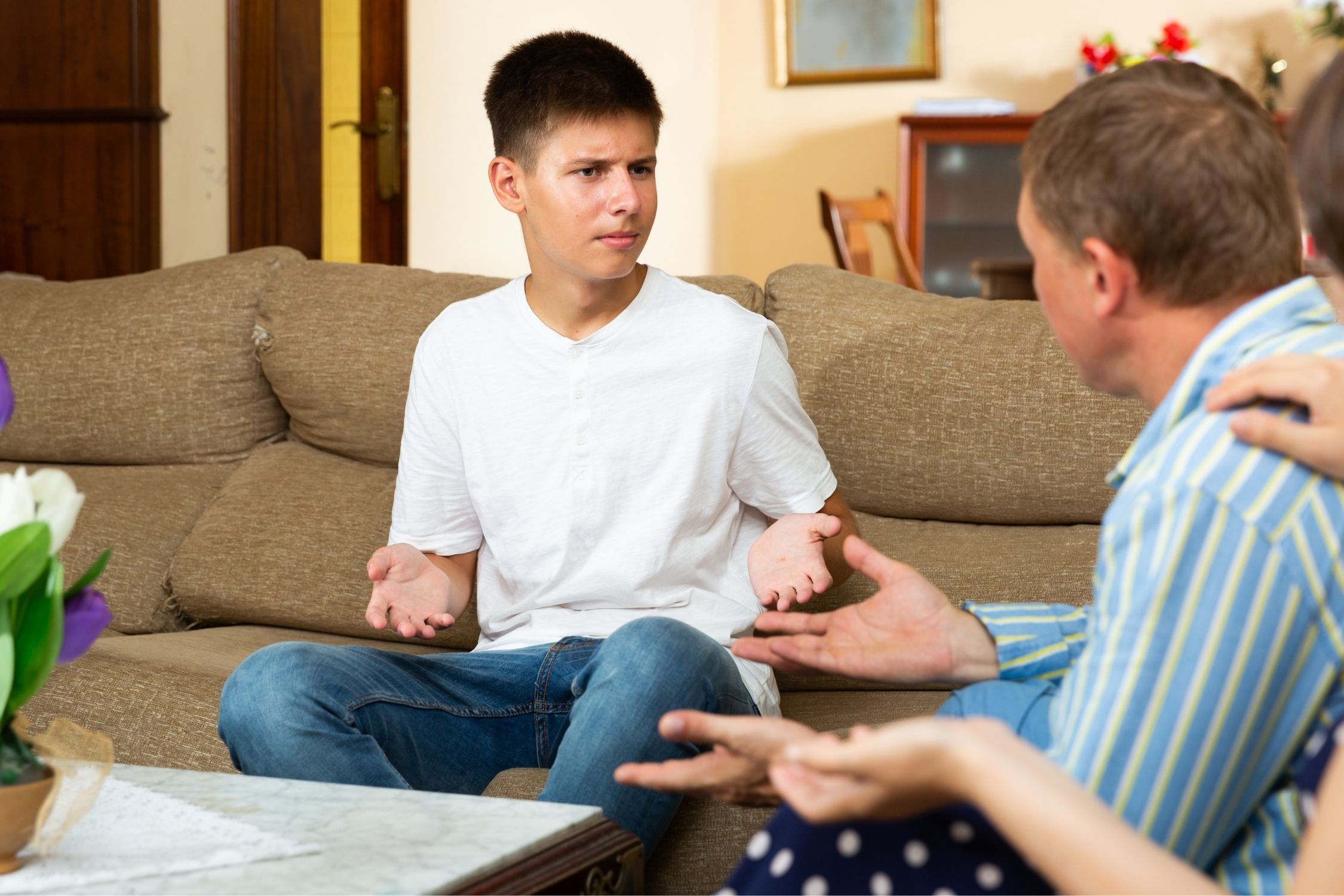 Upset teenager and parents