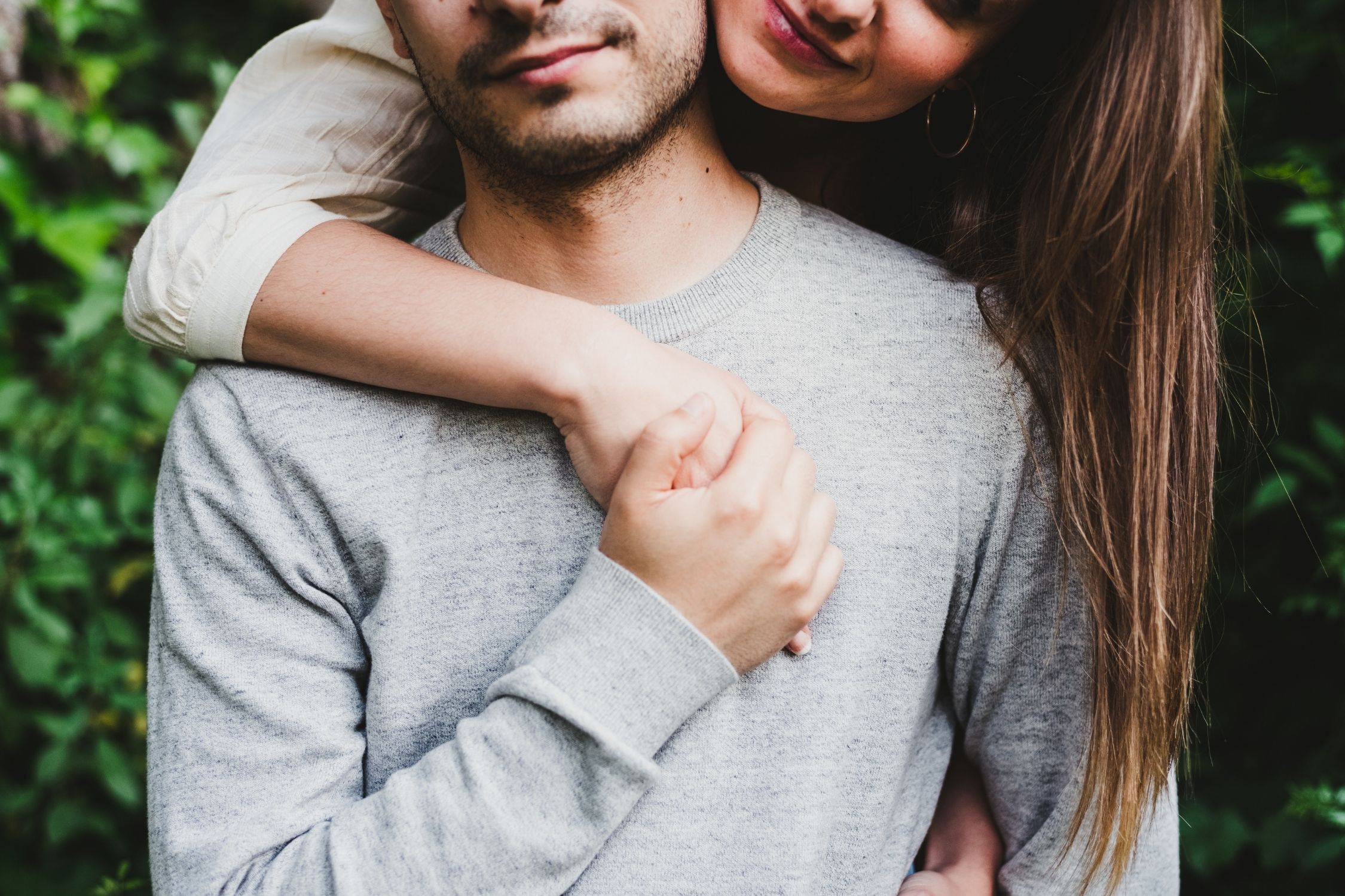 Couple with their arms around each other