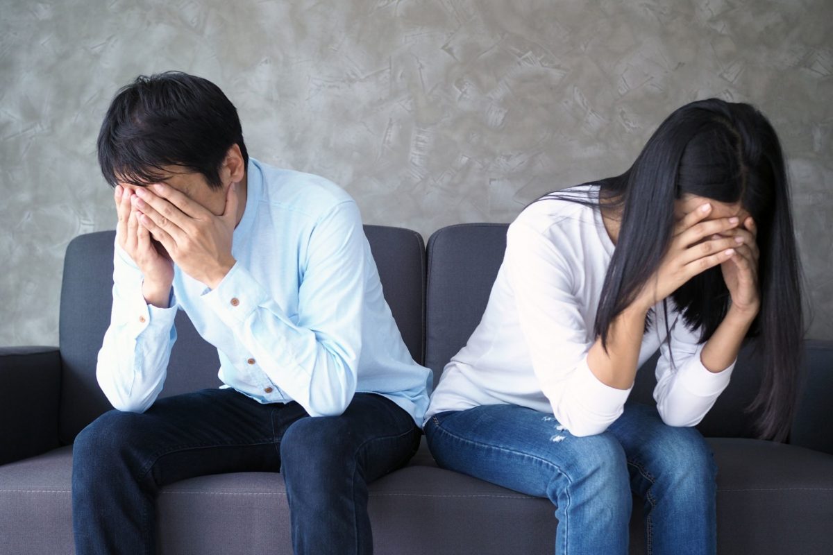 Couple upset sitting away from each other